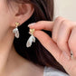 Aretes corazón con alas