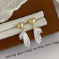 Aretes de alas y corazon